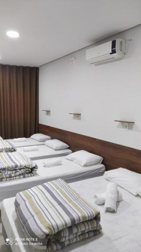 Flat familiar com ar,wi fi,cozinha e garagem
